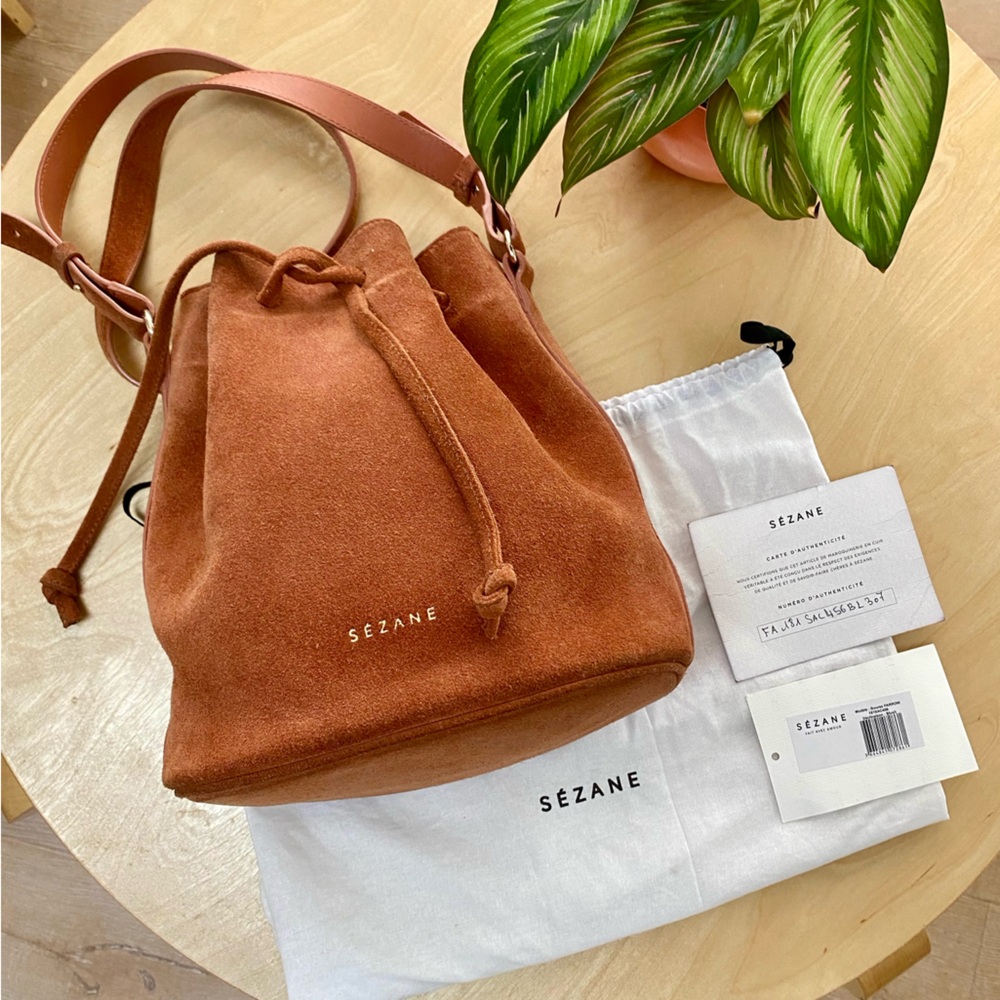 Sezane Farrow blush suede drawstring bucket bag with shoulder strap